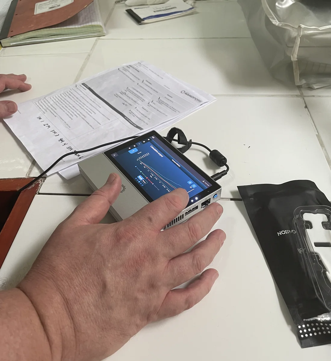 Portable sequencing device in use